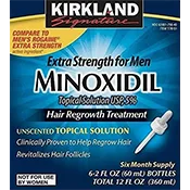 The packaging for Kirkland Signature Minoxidil Topical Solution 5% for men, labeled as "Extra Strength for Men." The design features a blue background with bold text highlighting its use as a hair regrowth treatment