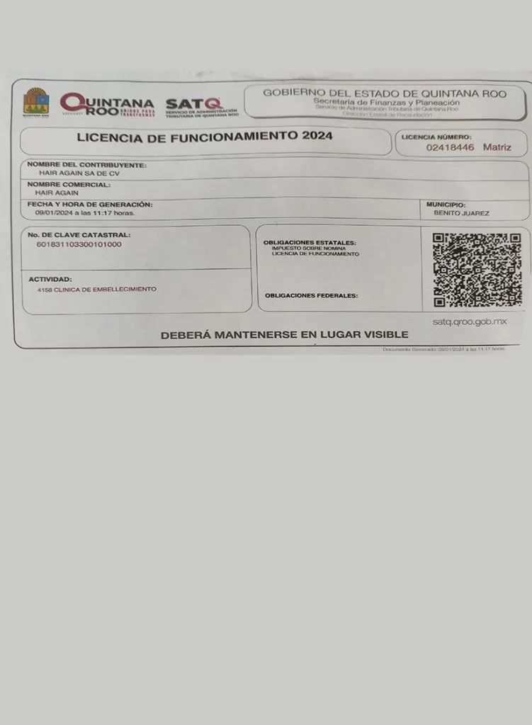 Photograph of a Mexican tax document showing financial details and filing information SAT Licencia de Funcionamiento