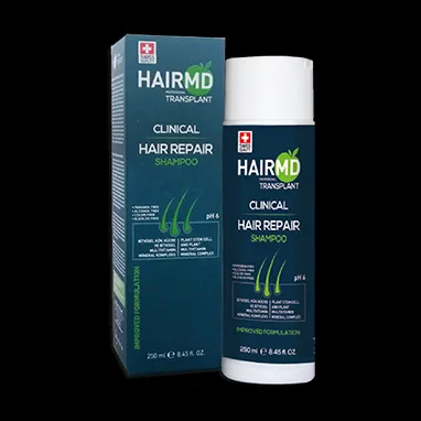 Product image of HairMD Clinical Hair Repair Shampoo , featuring a green box and white dispenser bottle against a black background