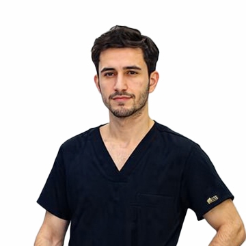 Hasam Aydogan, hair transplant technician, wearing black scrubs
