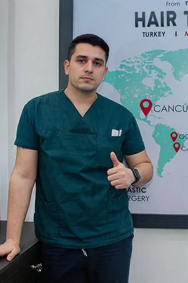 Hair transplant doctor in scrubs with Cancun location marker