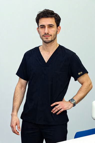 Hair transplant technician in black scrubs at Turkey clinic
