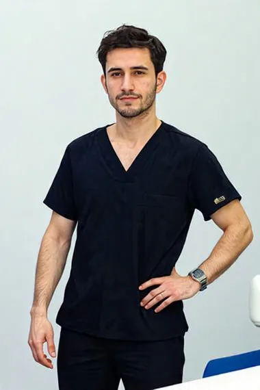 Hair transplant technician in black scrubs at Turkey clinic